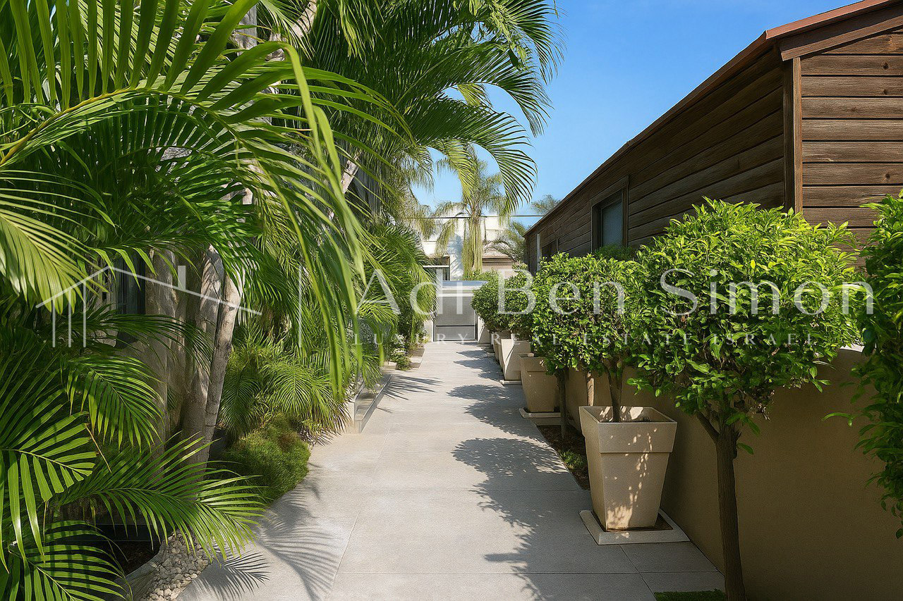 בשכונת נווה חיים וילה מיוחדת בסגנון כפרי מודרני עטופה בריק על קירות בכניסה לבית סלון מרווח ומטבח מודרני